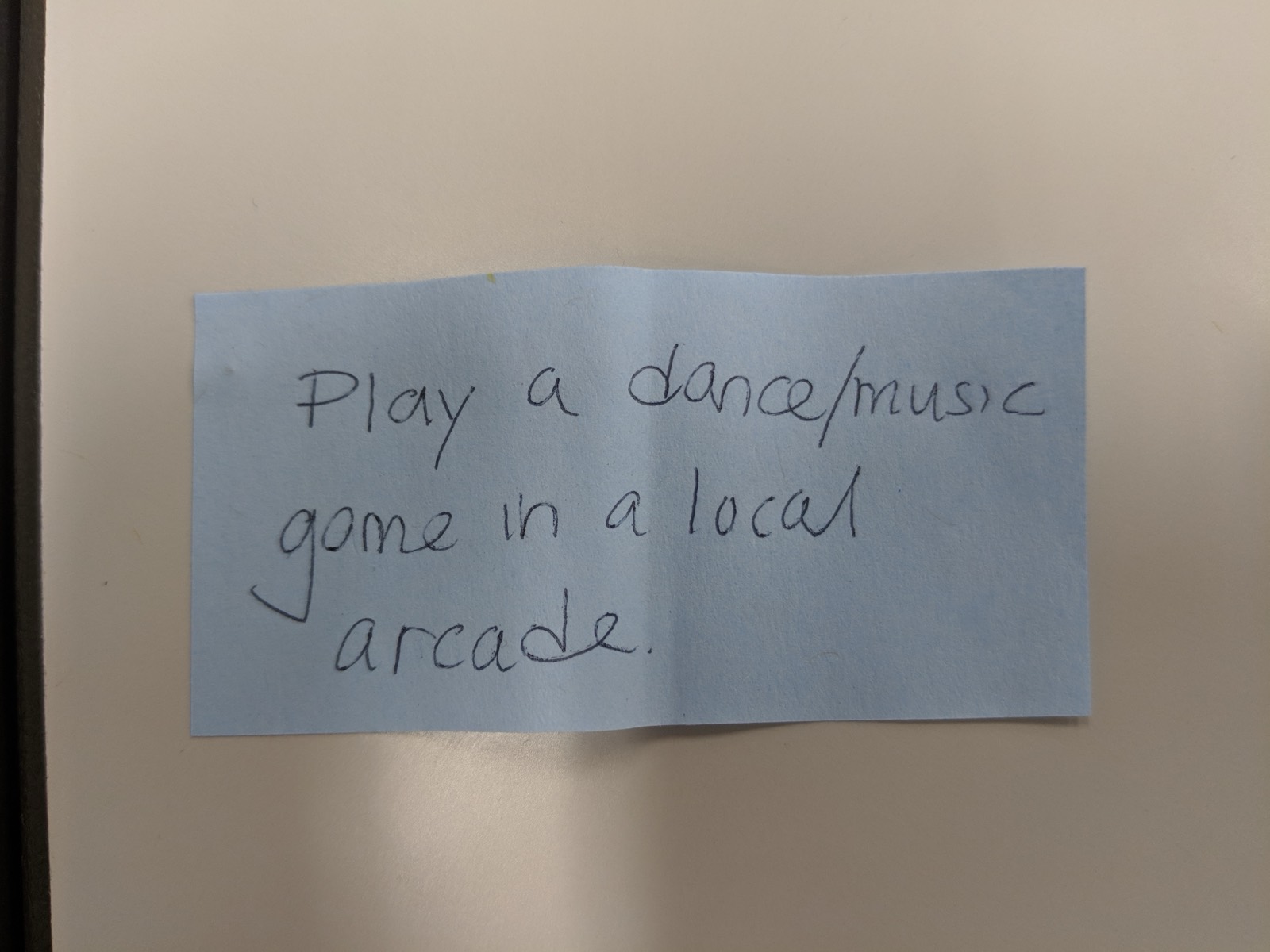 V1 handwritten recommendation slip: Play a dance/music game in a local arcade